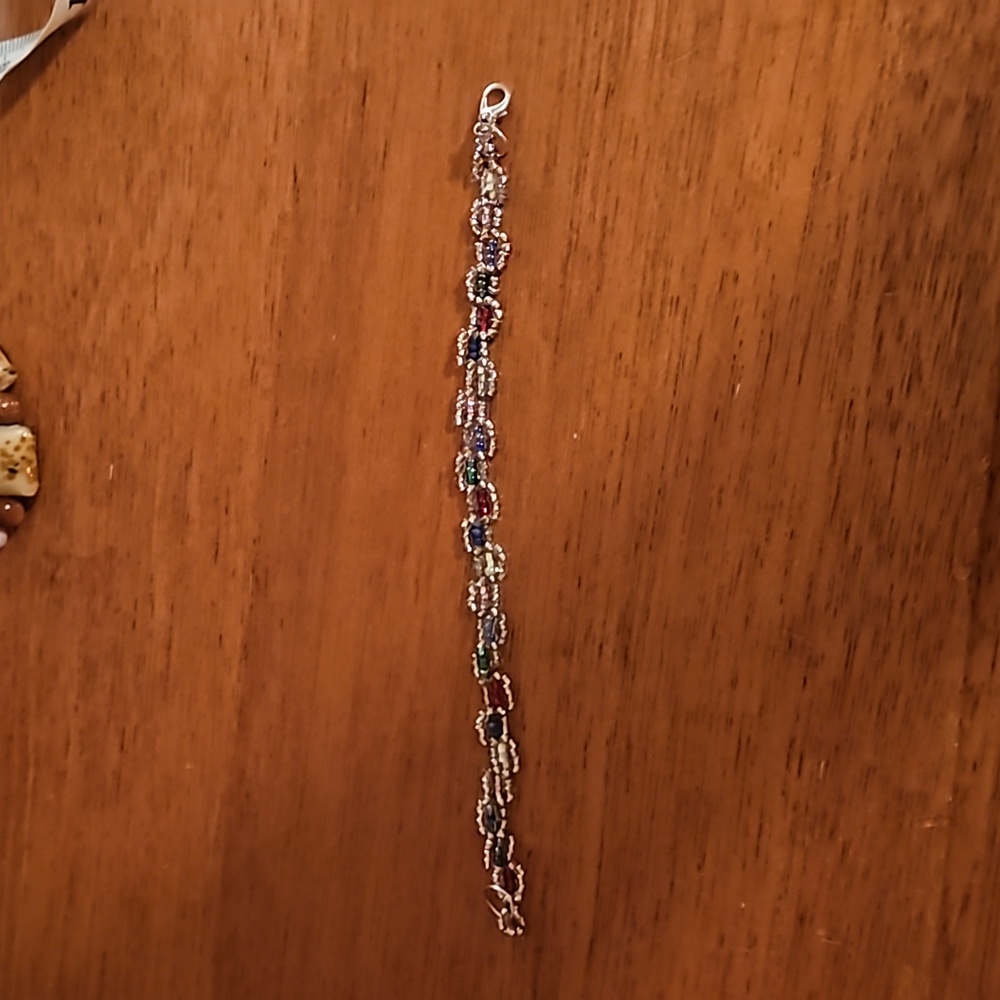 Homemade beaded silver and rainbow colour bracelet